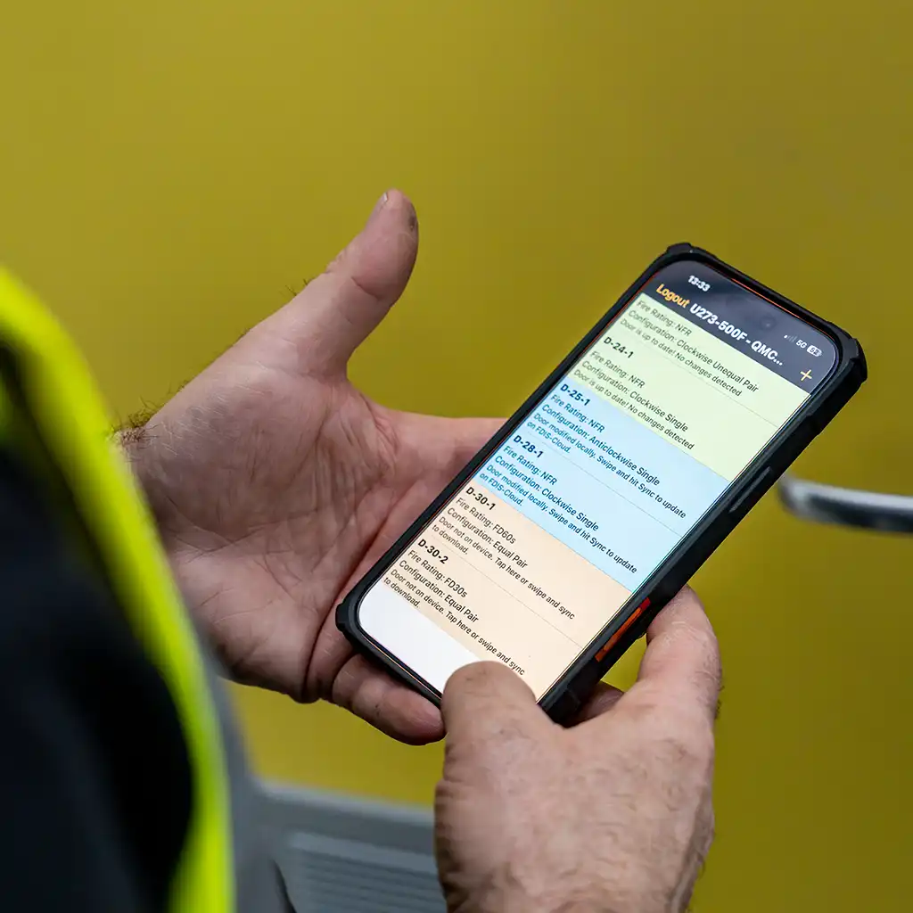 man checking smart phone inspection app