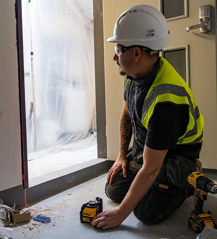 Fire Door Inspection Solutions - Fire Door Installer Checking Measurements