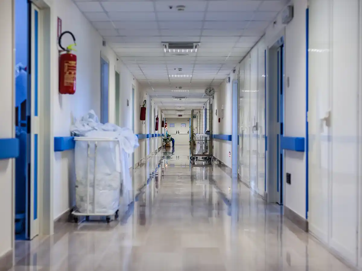 Empty hospital corridor with clean floors.