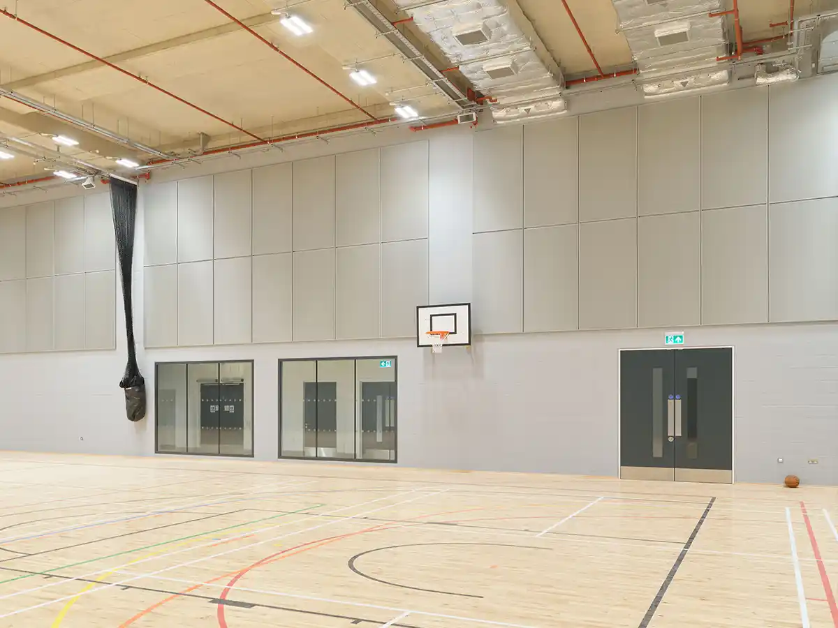 Indoor sports hall with basketball hoop